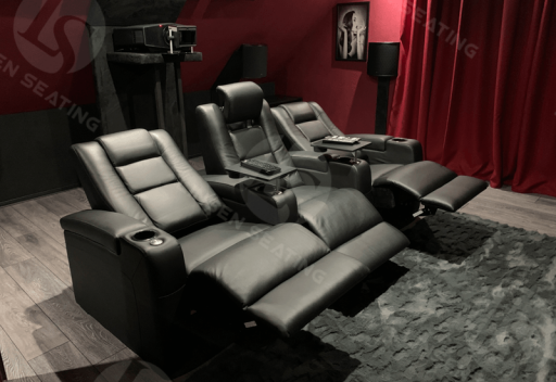 small private home cinema with black leather recliners